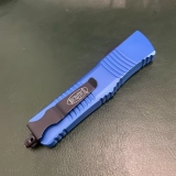 MT Combat Troodon D/E OTF Automatic Knife Blue (3.8" Black) (2) MT Combat Troodon D/E OTF Automatic Knife Blue (3.8" Black) (2)