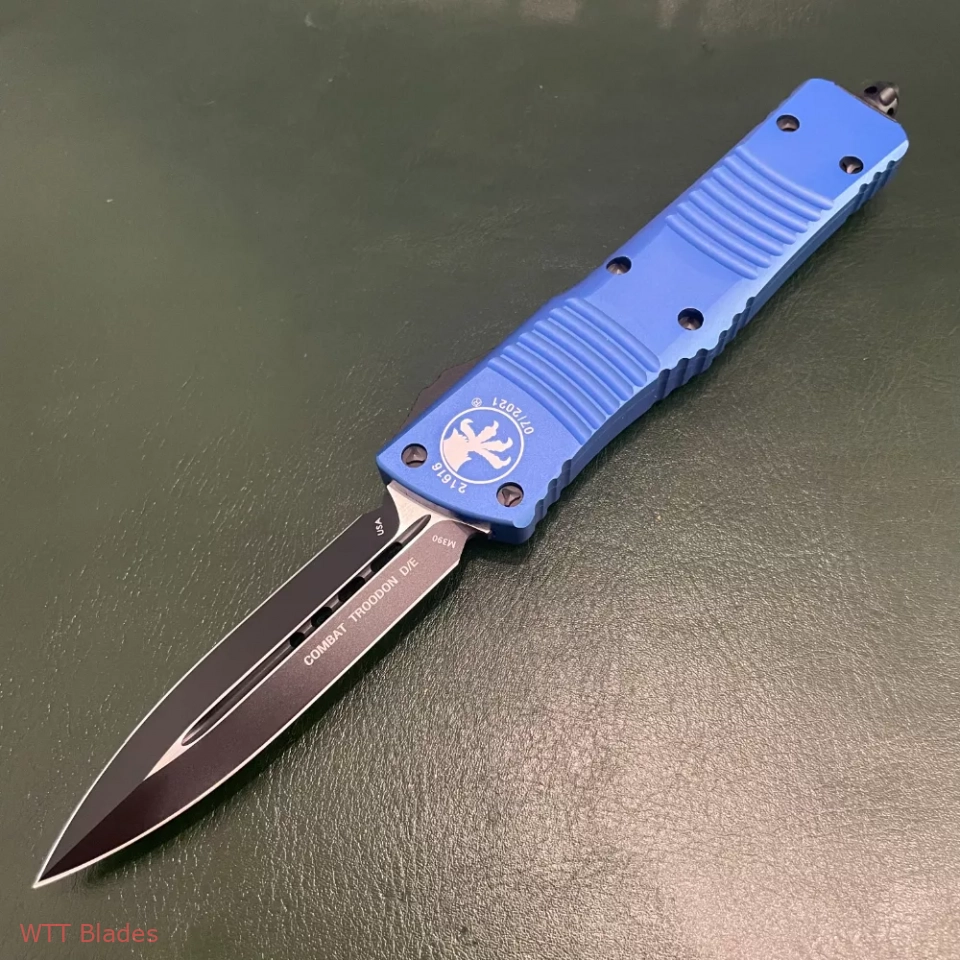 MT Combat Troodon D/E OTF Automatic Knife Blue (3.8" Black) (4) MT Combat Troodon D/E OTF Automatic Knife Blue (3.8" Black) (4)