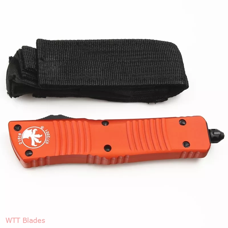 MT Combat Troodon D/E OTF Automatic Knife Orange (3.8" Black) (6) MT Combat Troodon D/E OTF Automatic Knife Orange (3.8" Black) (6)